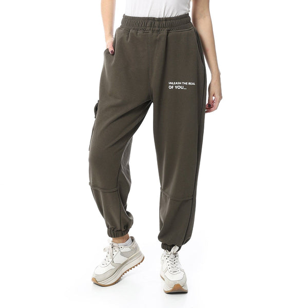 Women's elastic pants with pockets in olive green